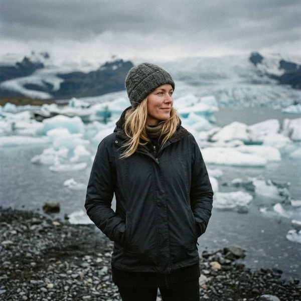 Sigrún Halldórsdóttir, travel writer based in Höfn, standing at the shore of Jokulsarlon glacier lagoon in Vatnajökull National Park, Iceland